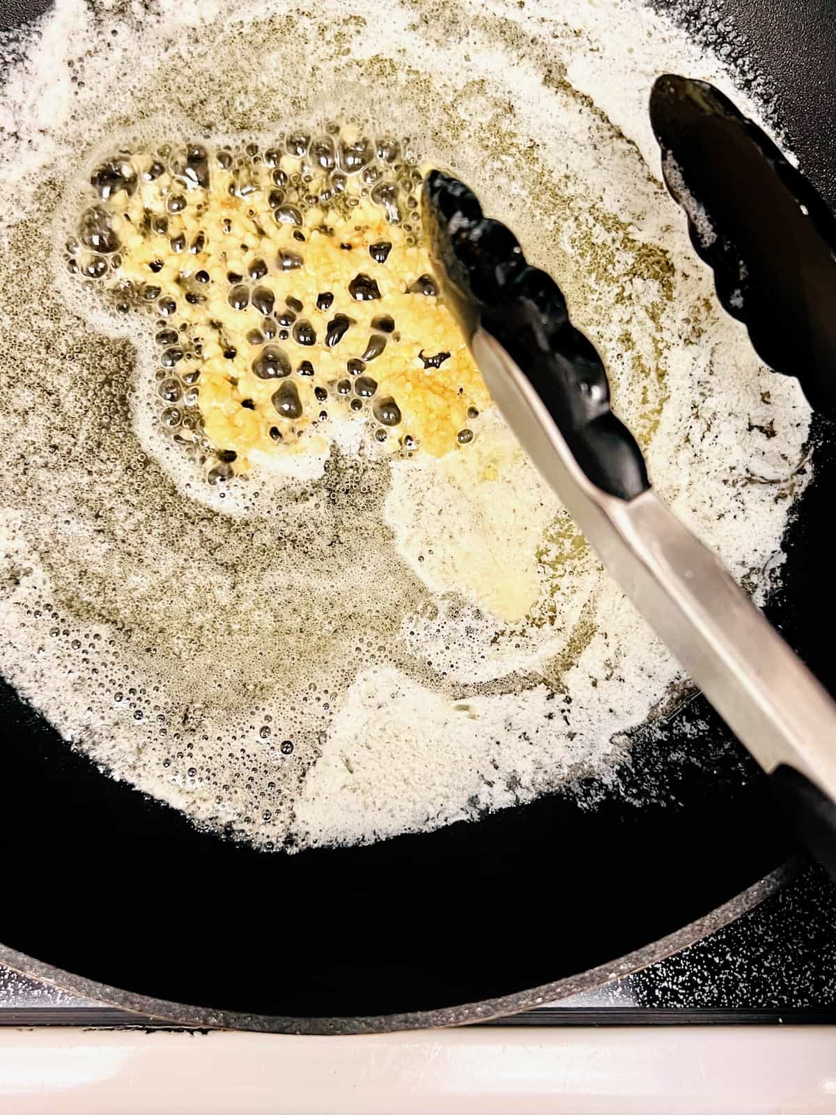Melted butter and garlic in the pan.