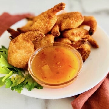 Plate of coconut shrimp with pineapple dipping sauce.