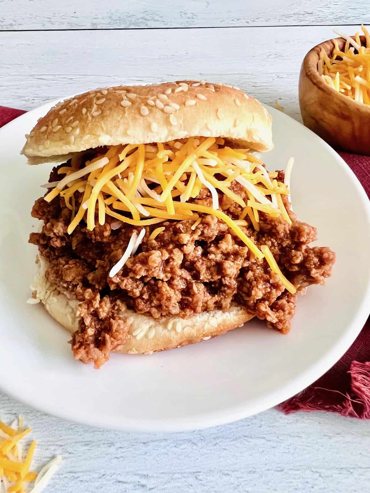 Plated gluten-free sloppy joe with cheese on top.