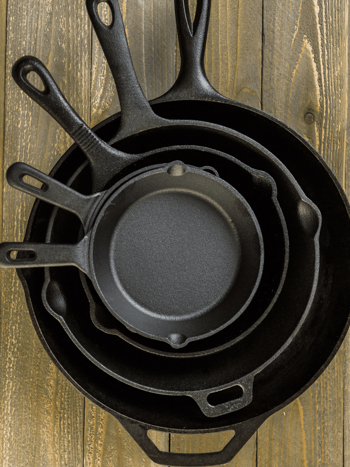 Best Pans for Searing Steaks Cast iron skillets stacked.