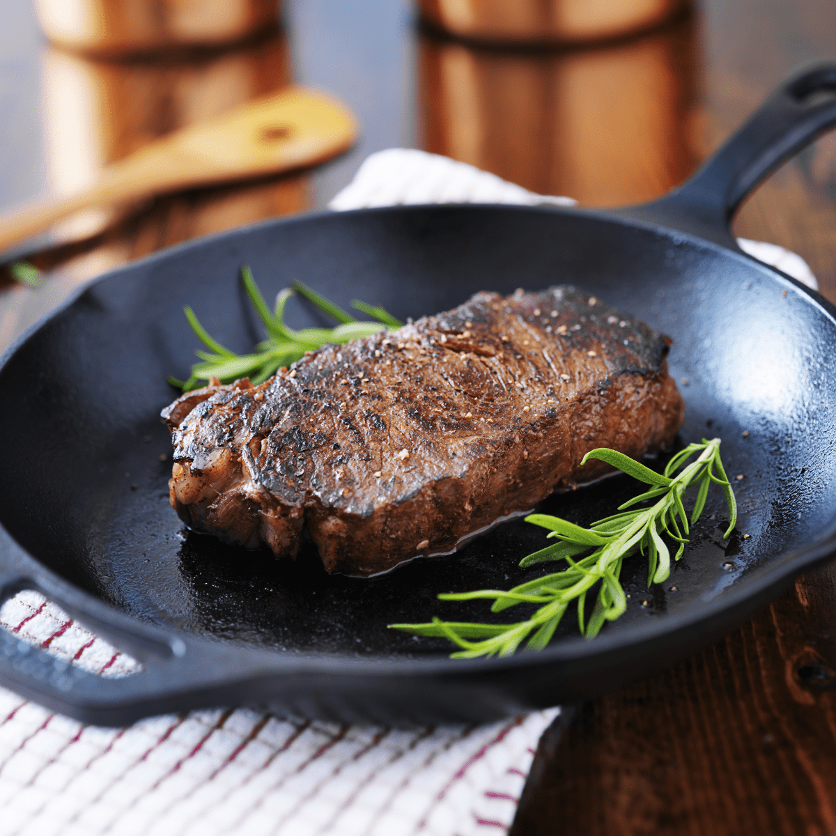 A steak seared in a pan.