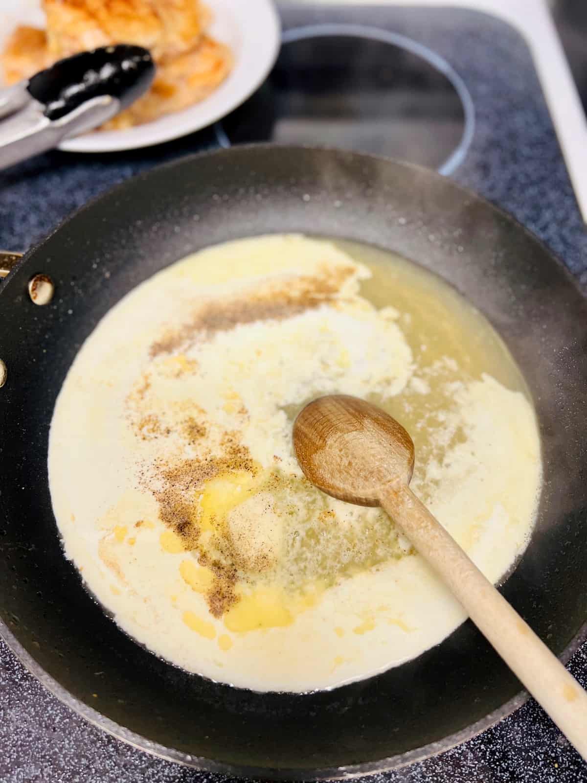 Adding butter and ingredients to skillet.