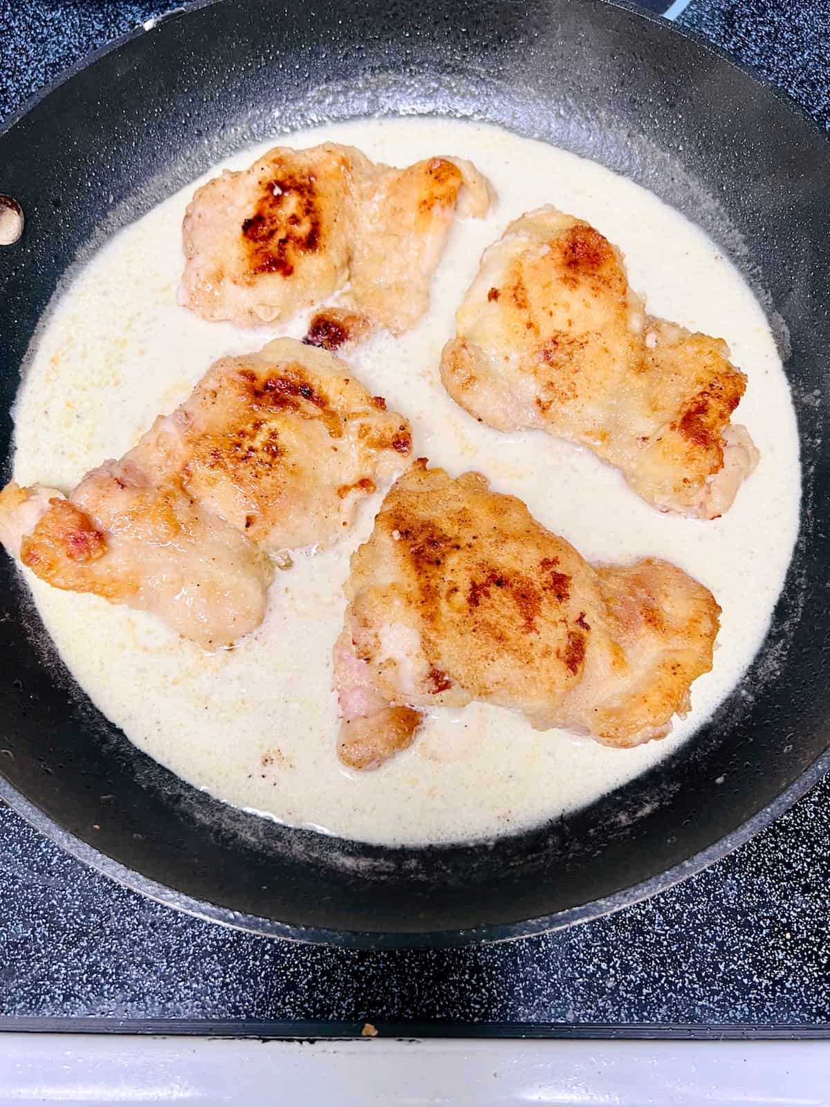Creamy Lemon Dill Butter ChickenÂ Adding chicken back to pan with sauce.