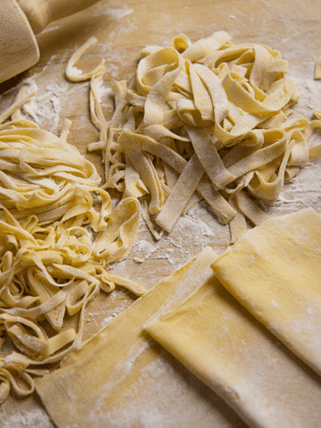 Fresh pasta on a wooden surface.