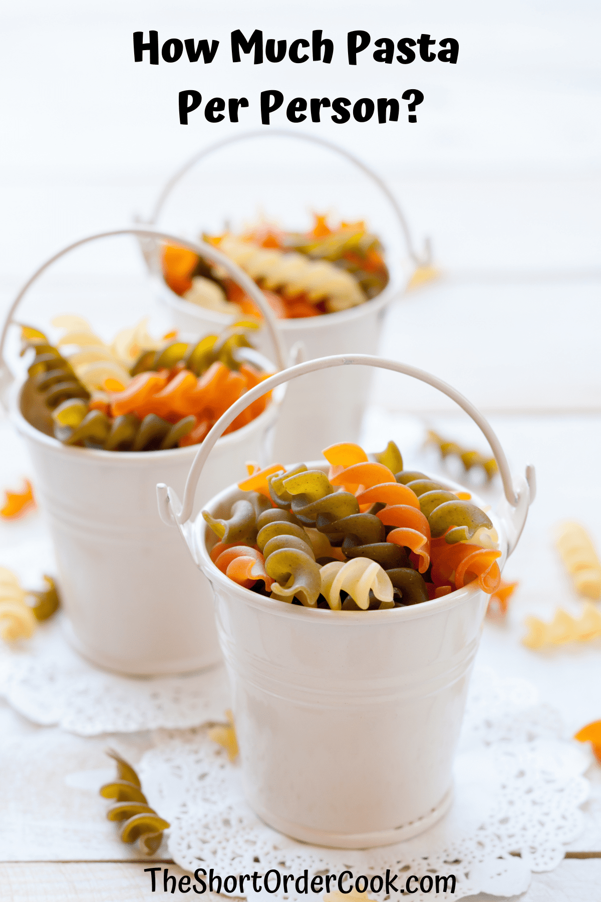 Small white buckets filled with dry pasta.