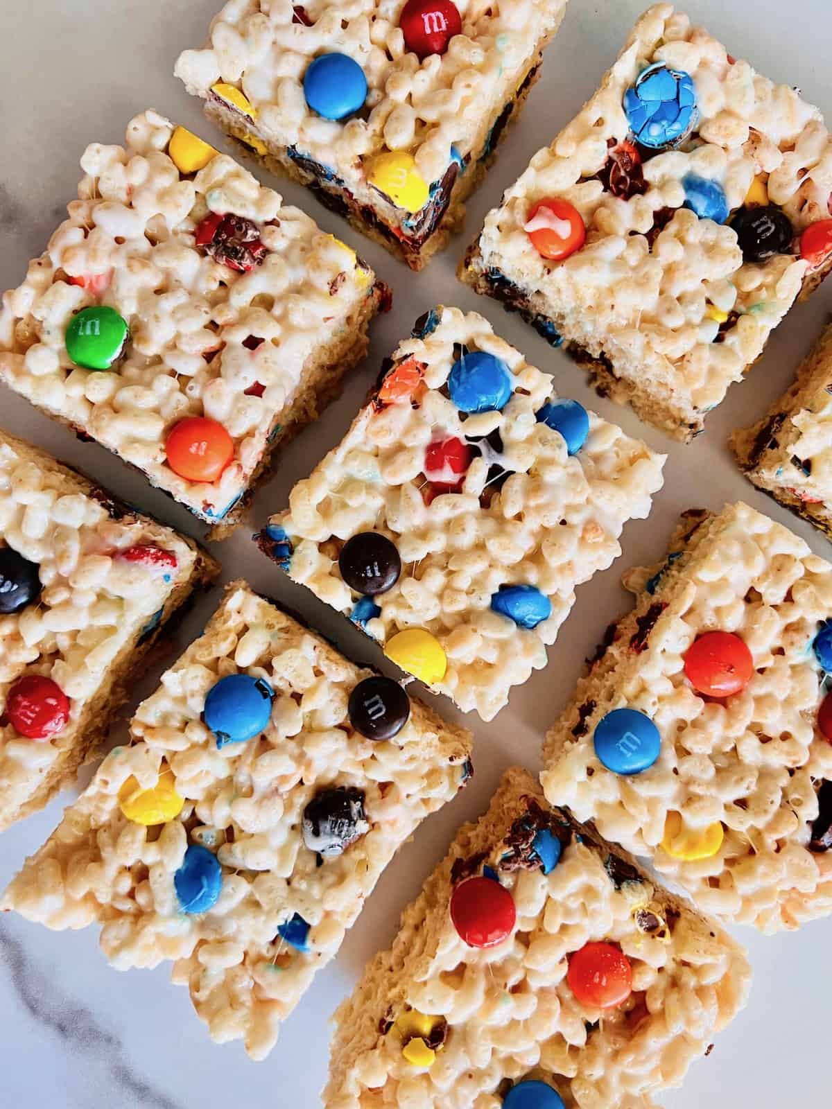 M&M Rice Krispies Treats Overhead of 9 squares on a table.