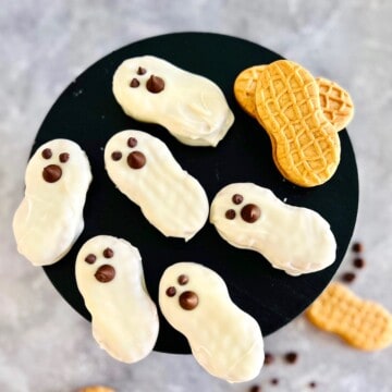 Ghost decorated peanut butter cookies on a plate.