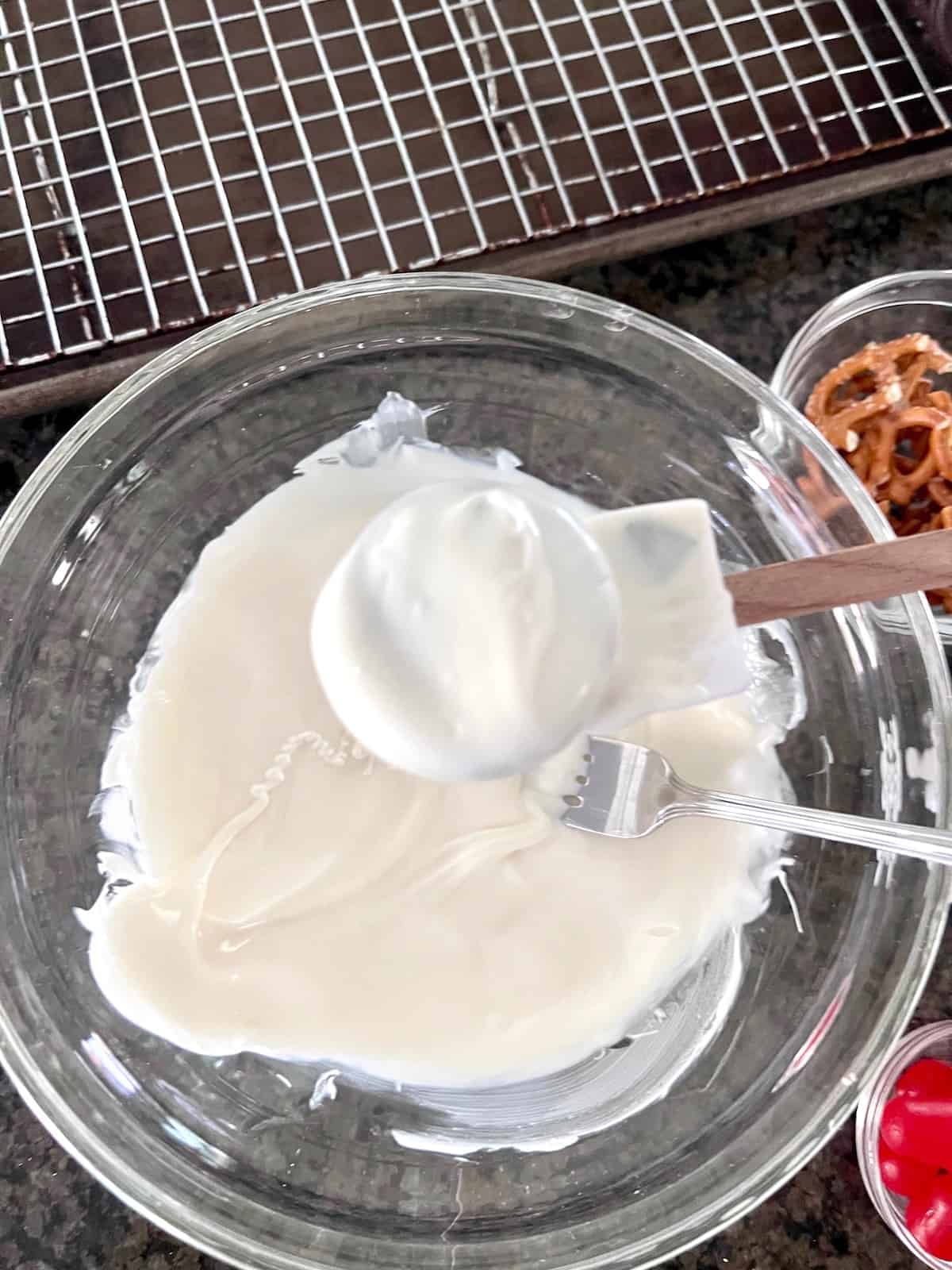 Dip Oreo cookie into melted white candy.