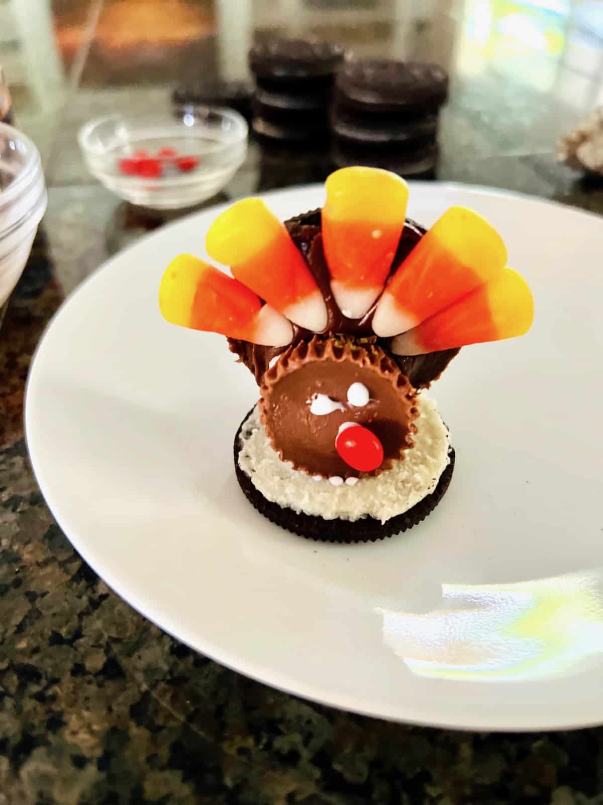An Oreo turkey with peanut butter cups body and candy corn feathers.