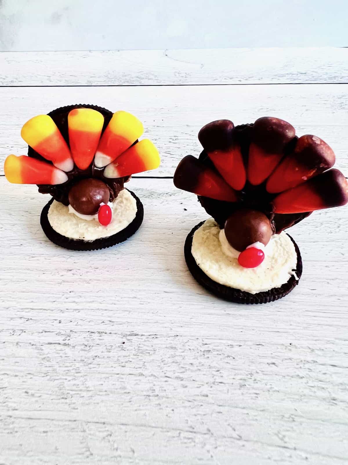 Two Oreo turkeys decorated and ready to display or eat for Thanksgiving.