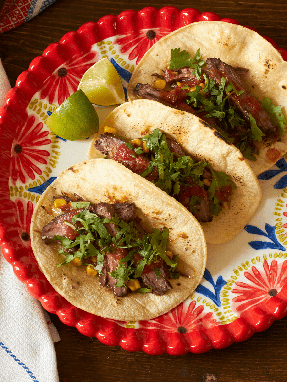 Flank steak tacos on a plate ready to eat.