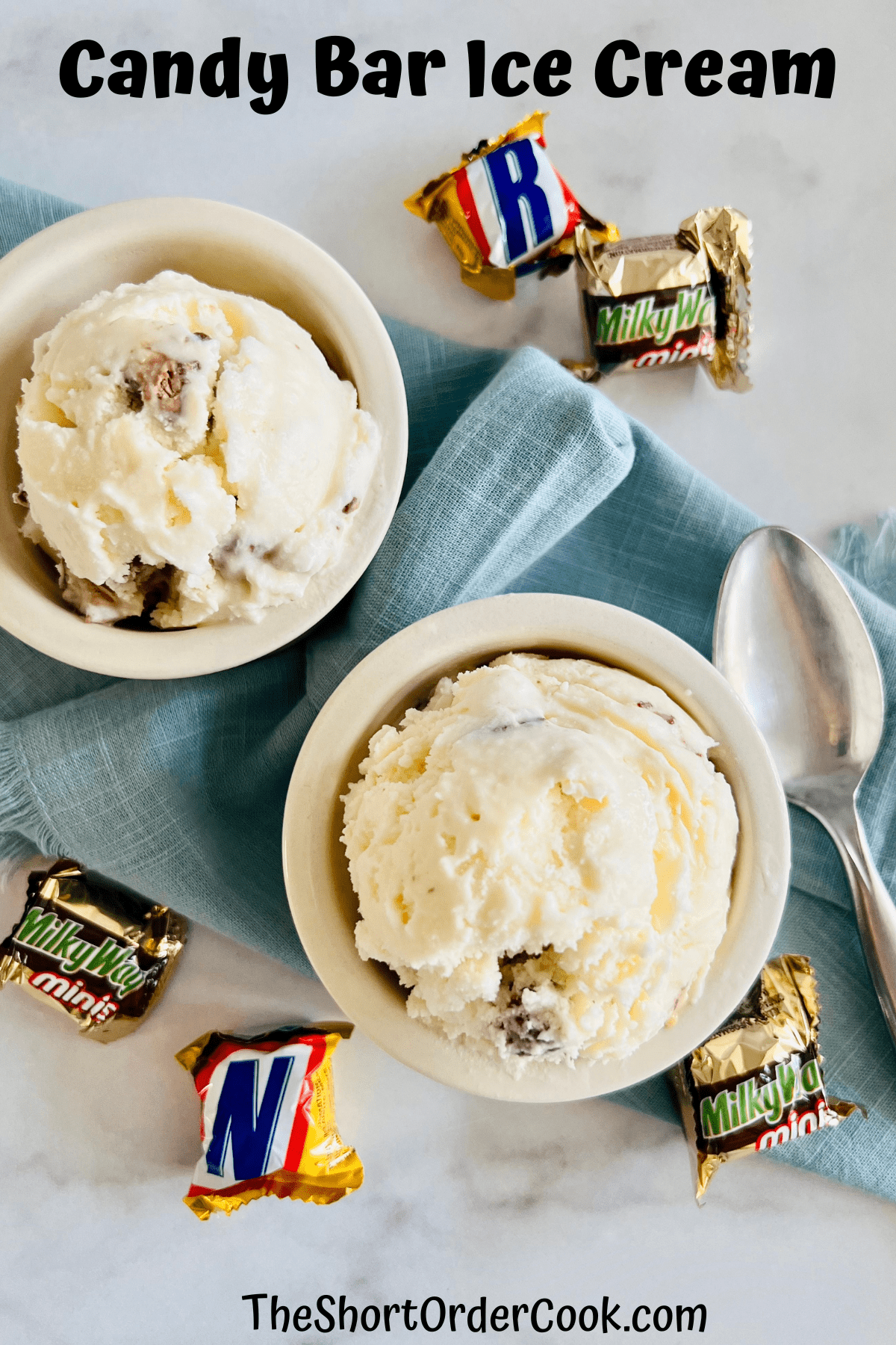 Two bowls with scoops of candy bar ice cream ready to eat with a spoon.
