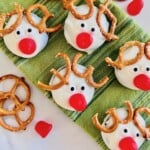 White coated Oreo cookies decorated to look like reindeer.