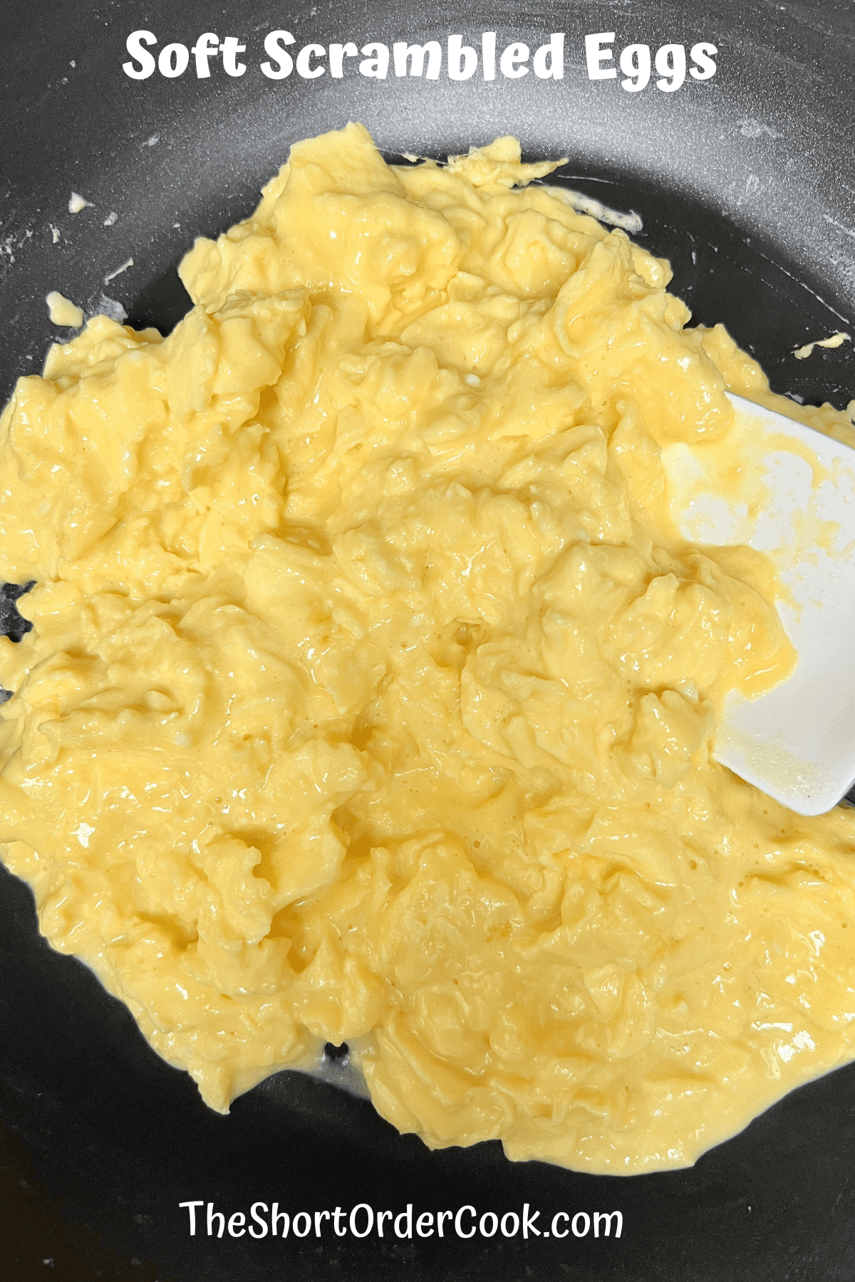 Soft Scrambled Eggs in a skillet cooked and ready to eat.