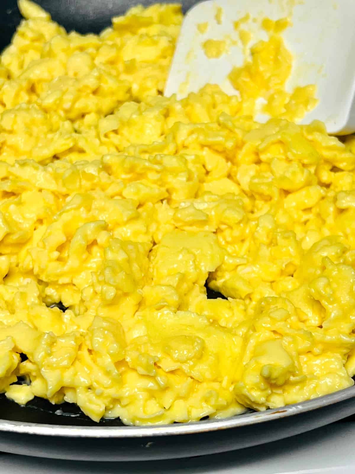 Closeup of how slow cooked scrambled eggs looks when done.