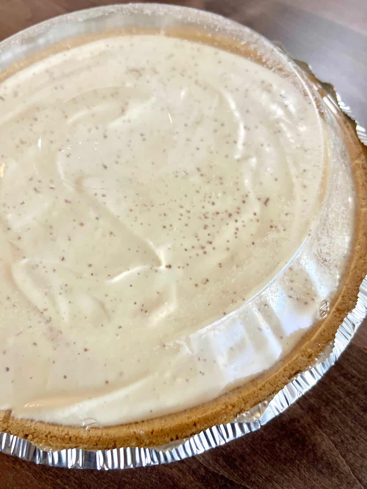 No-Bake Eggnog Pie Covered with dome.