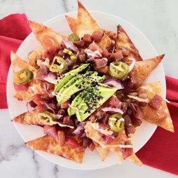 Ahi Tuna Poke Nachos with Wontons Recipe Card image of a plate stacked high ready to eat.