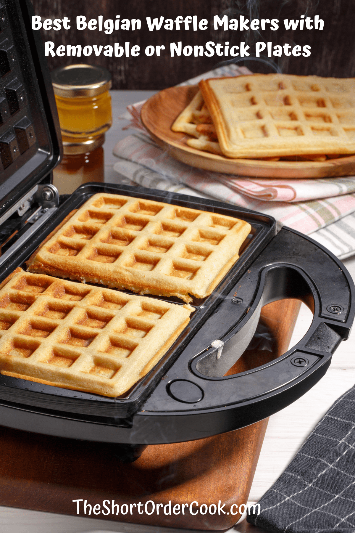 Square Belgian waffles cooked and ready to remove from the waffle iron.