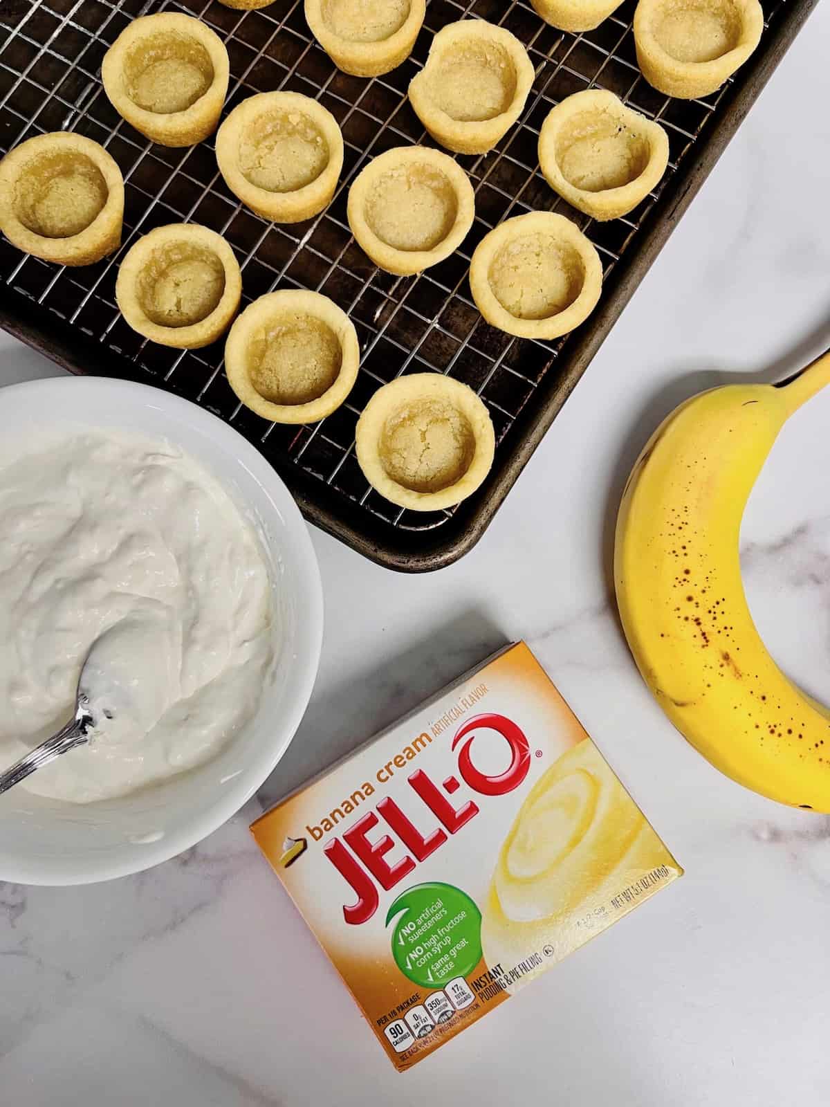 Remove the cookie cups and cool on a baking rack.
