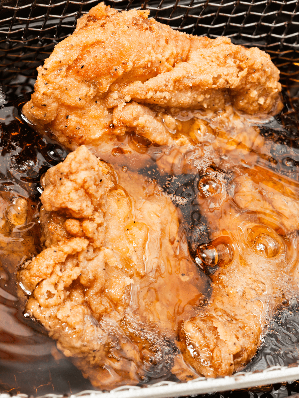 Best Deep Fryer for Chicken Wings Pieces frying in the basket.