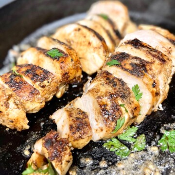 Cast Iron Chicken Breast cooked and Sliced in the pan.