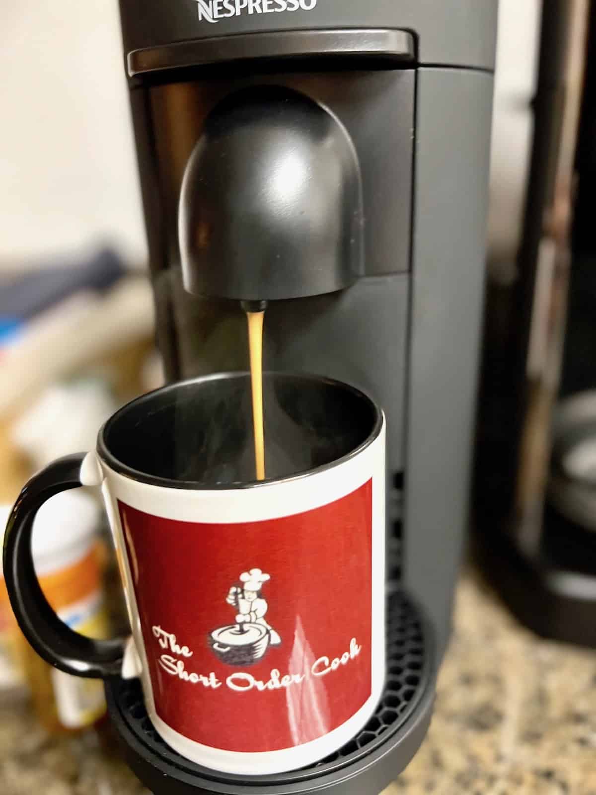  making coffee in the Nespresso machine.