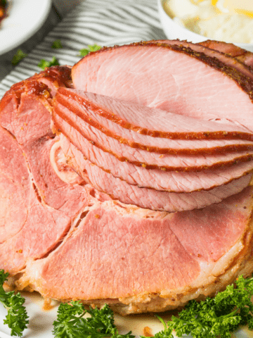 How Long to Cook a Spiral Ham on a platter ready to slice and serve.