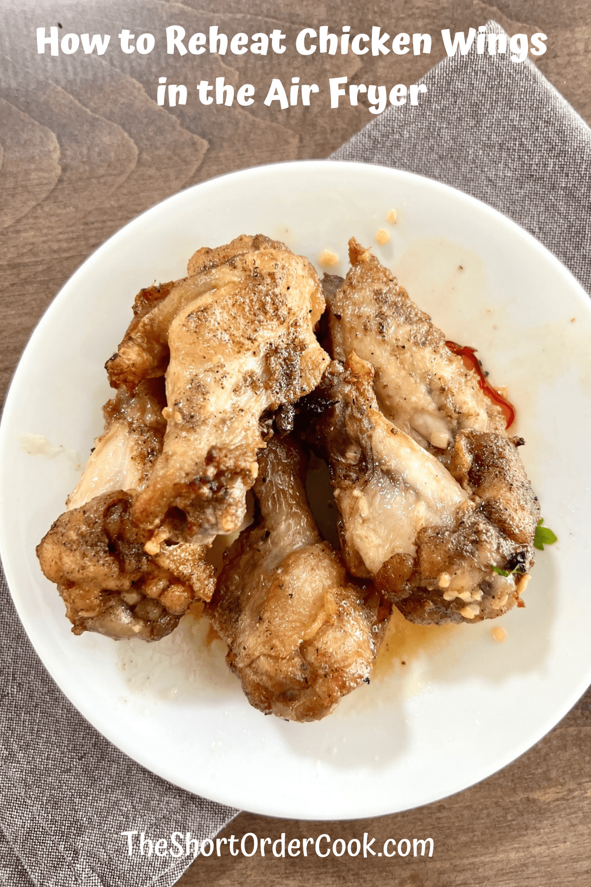 How to Reheat Chicken Wings in the Air Fryer plated with a linen napkin.