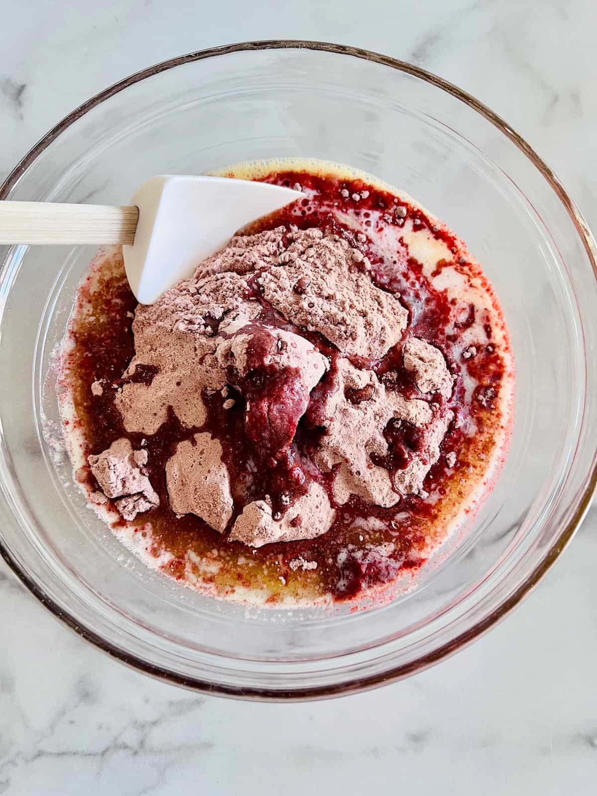 Red Velvet Brownies with Cake Mix Mixing wet & dry ingredients in the bowl.