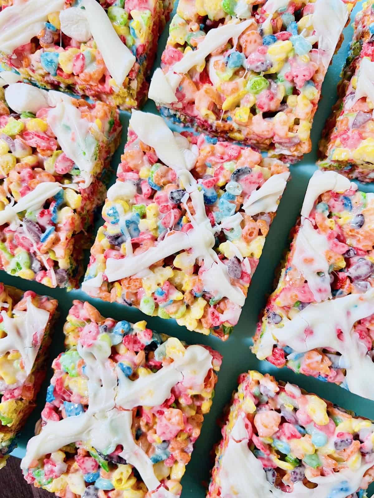 Fruity Pebbles Cereal Bars cut into squares.
