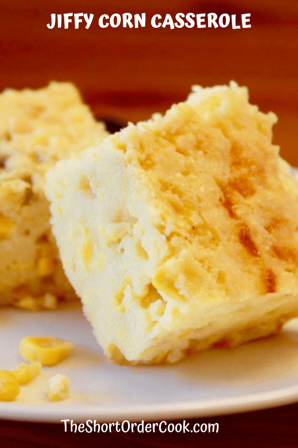 Slices of jiffy corn casserole with green chiles on a plate.