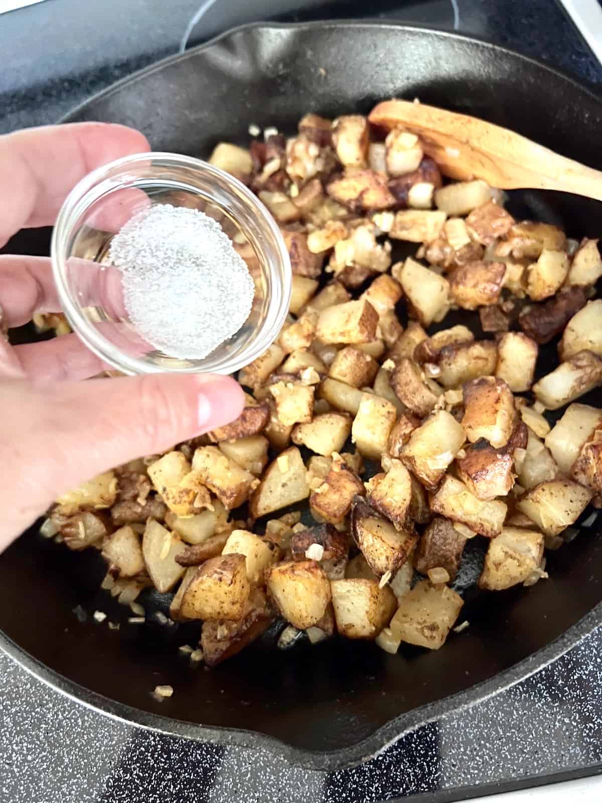 Add salt to cooked and ready to eat potatoes and onions.