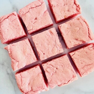 Squares of fresh baked strawberry brownies.