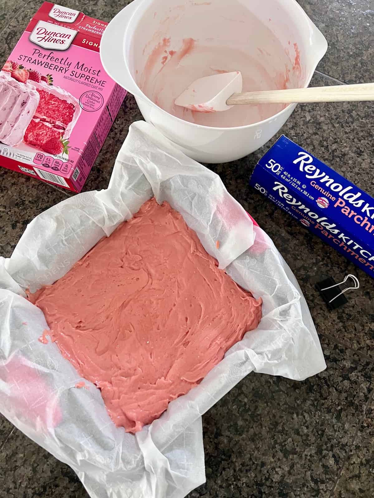 Strawberry Brownies raw batter in the 8x8 pan.