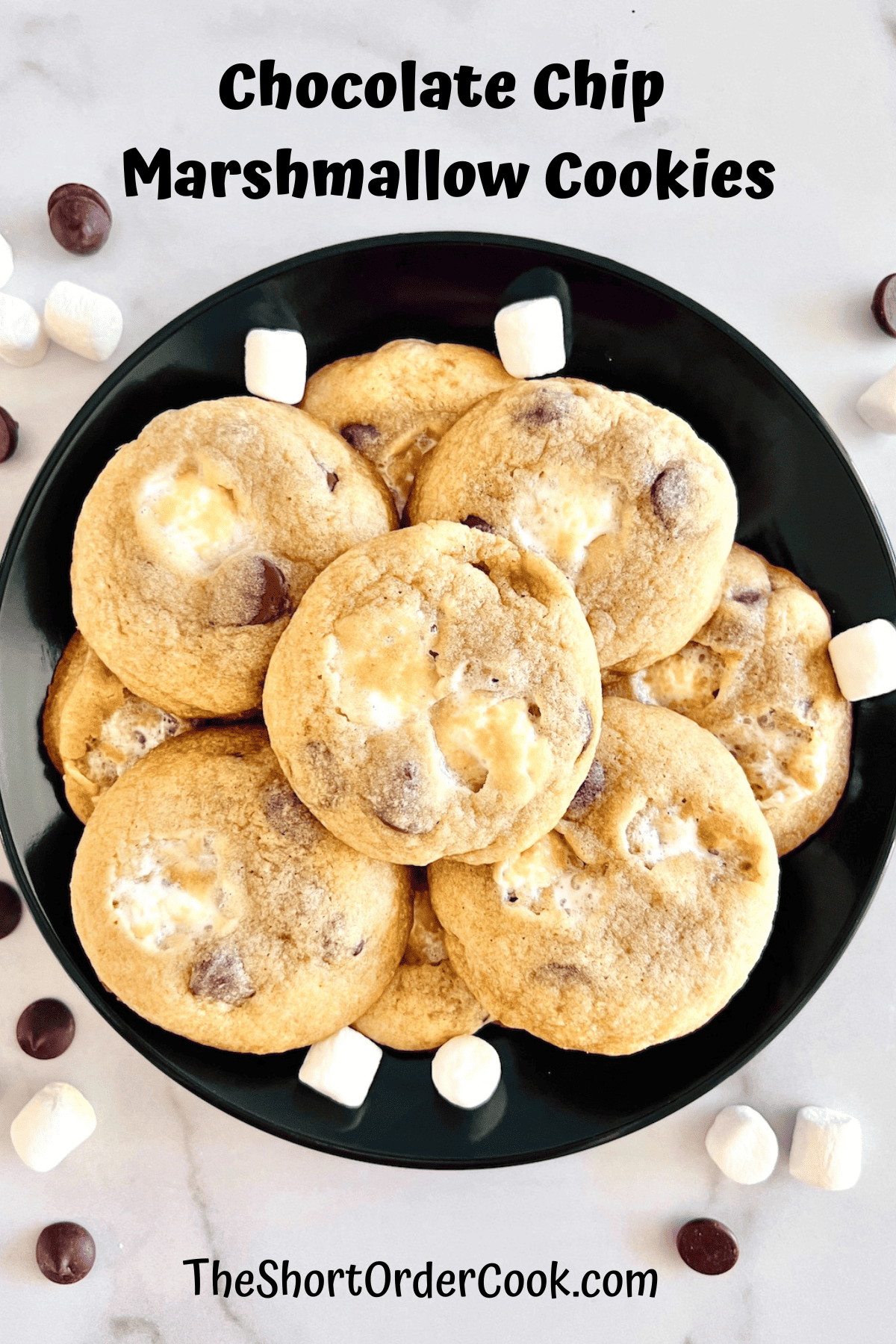 Chocolate Chip Cookies with mini Marshmallows stacked on a black plate ready to eat.