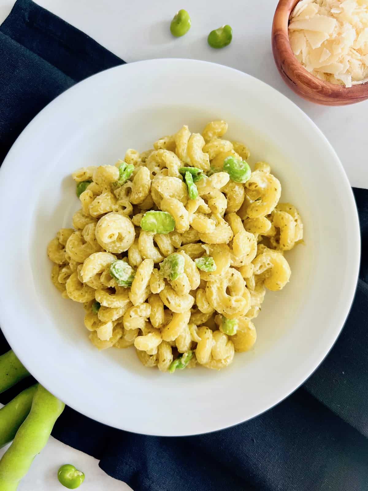 Creamy Pesto Pasta with Fava Beans Plated Ready to eat with a black napkin.