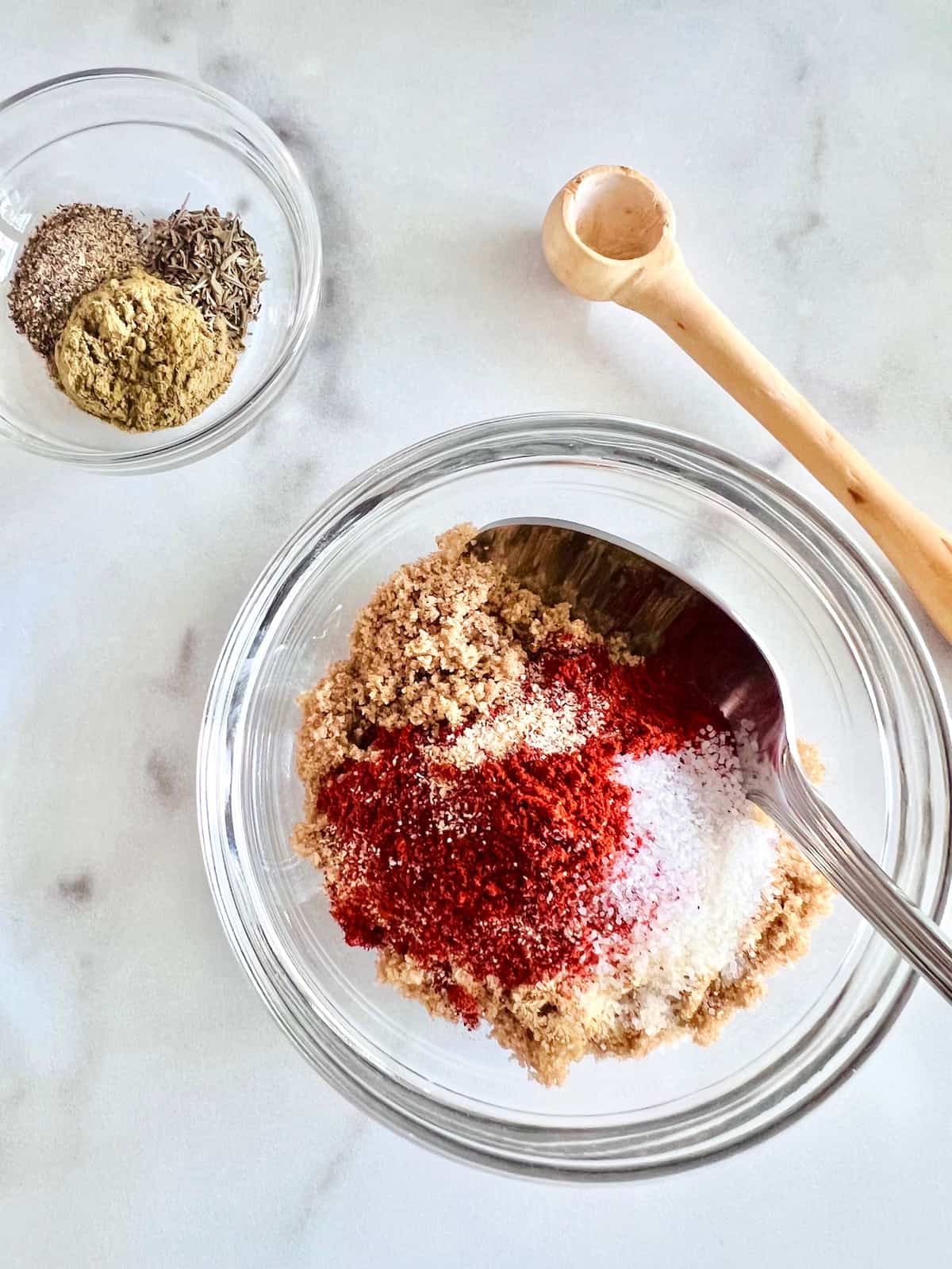 Mixing the spices together in a bowl.