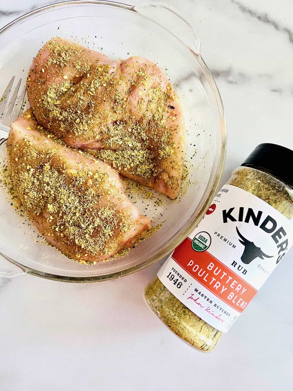 Seasoning blend rubbed on the raw boneless skinless chicken breasts.