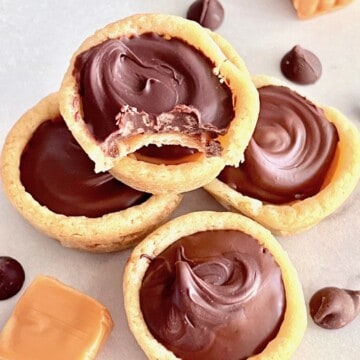 Bite out of a caramel and chocolate cookie cup - twix copycat.