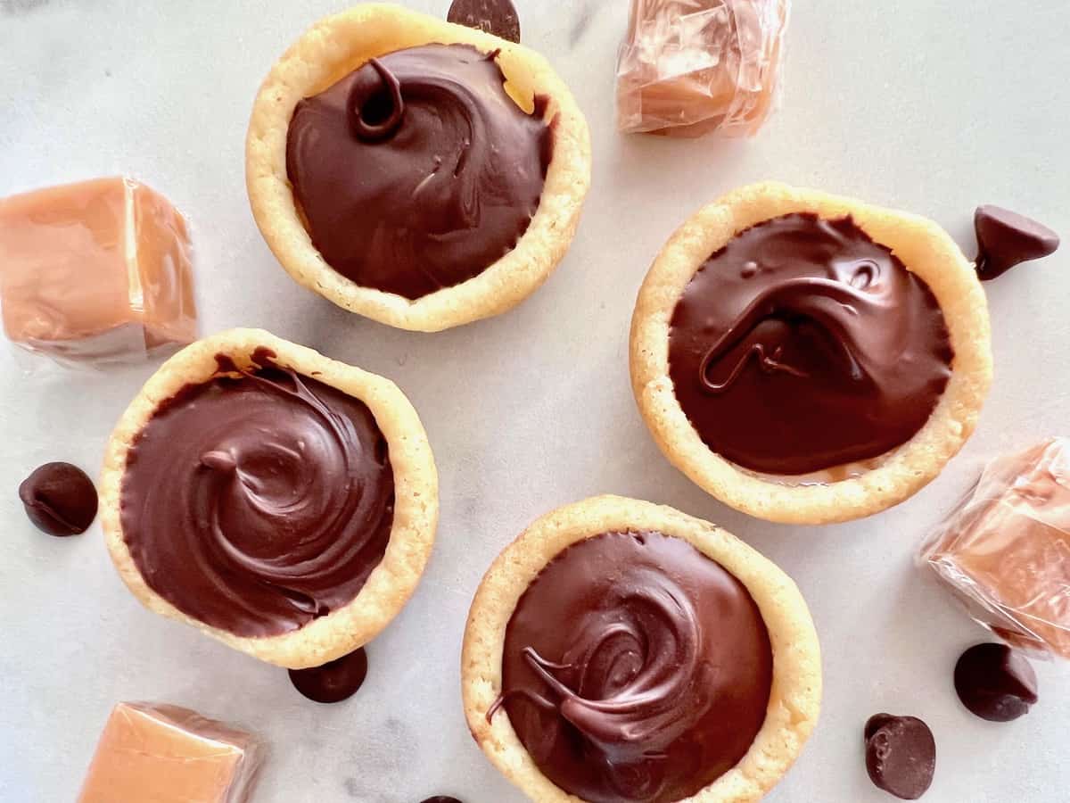 Twix cookies in a cup form made in a muffin tin.