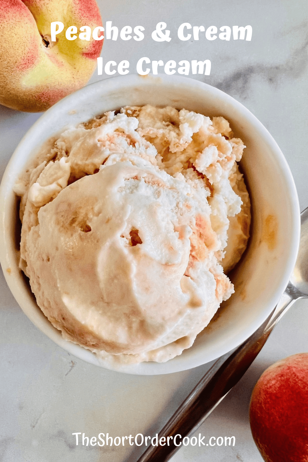 Overhead of a bowl of fresh summer peach swirled ice cream.