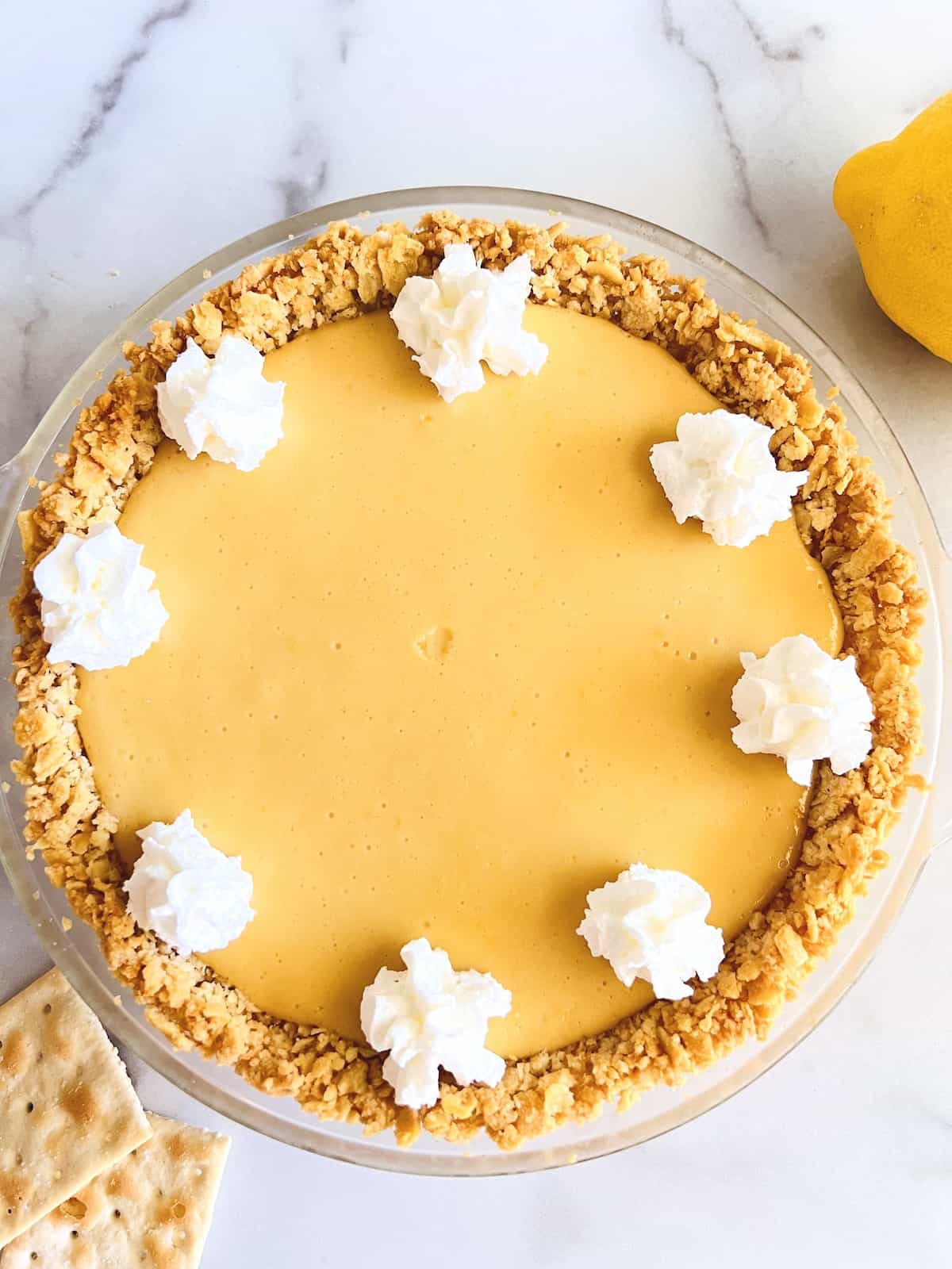North Carolina Lemon Pie with dollops of whipped cream on top.