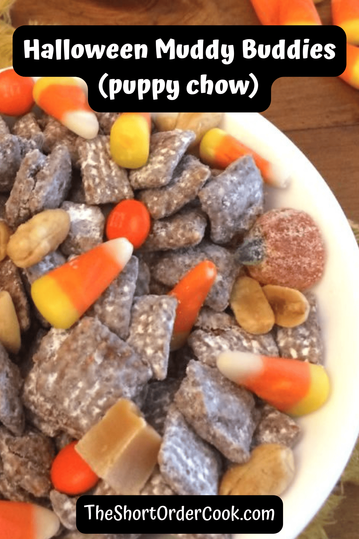 A bowl of peanut butter coated Chex cereal to make muddy buddies with Halloween candies.
