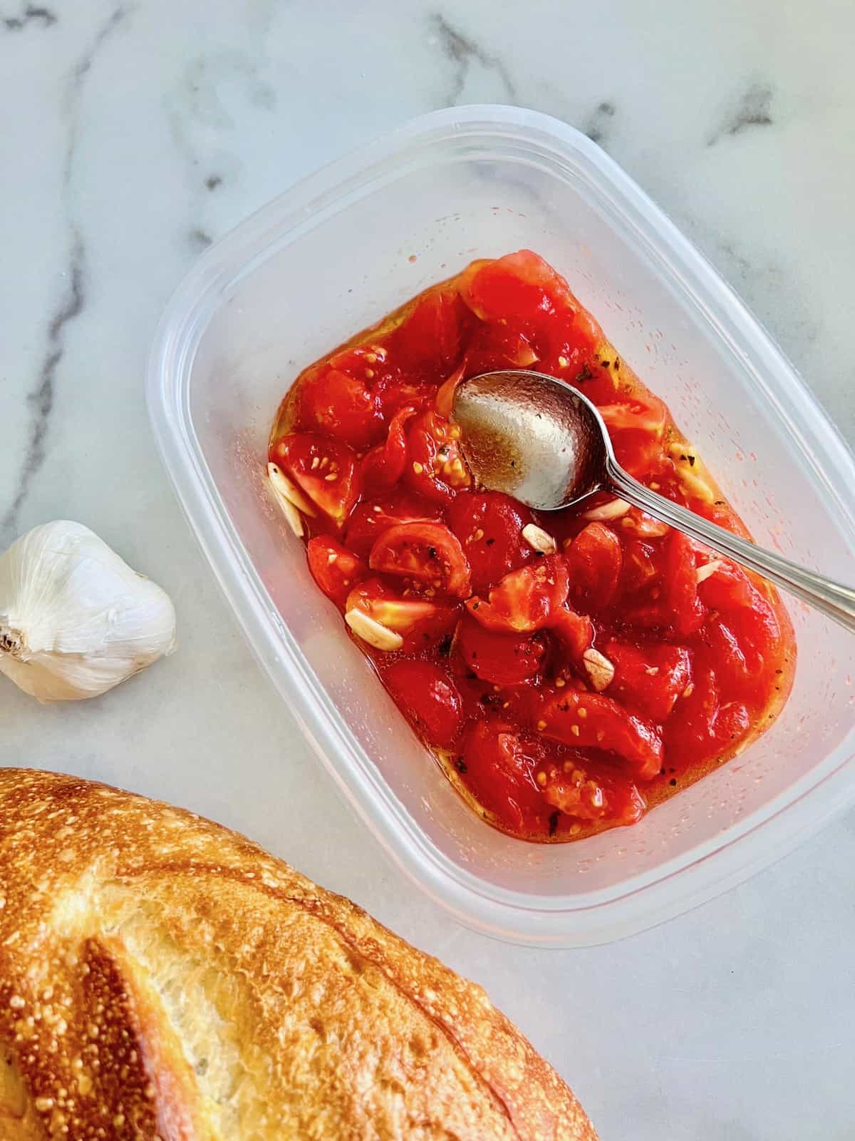 Italian Marinated Tomatoes ingredients chopped and in a container.