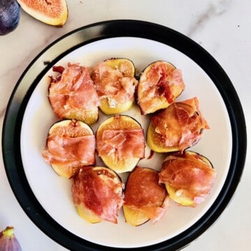 Roasted Prosciutto-Wrapped Figs Recipe Card Plated with figs to the side.