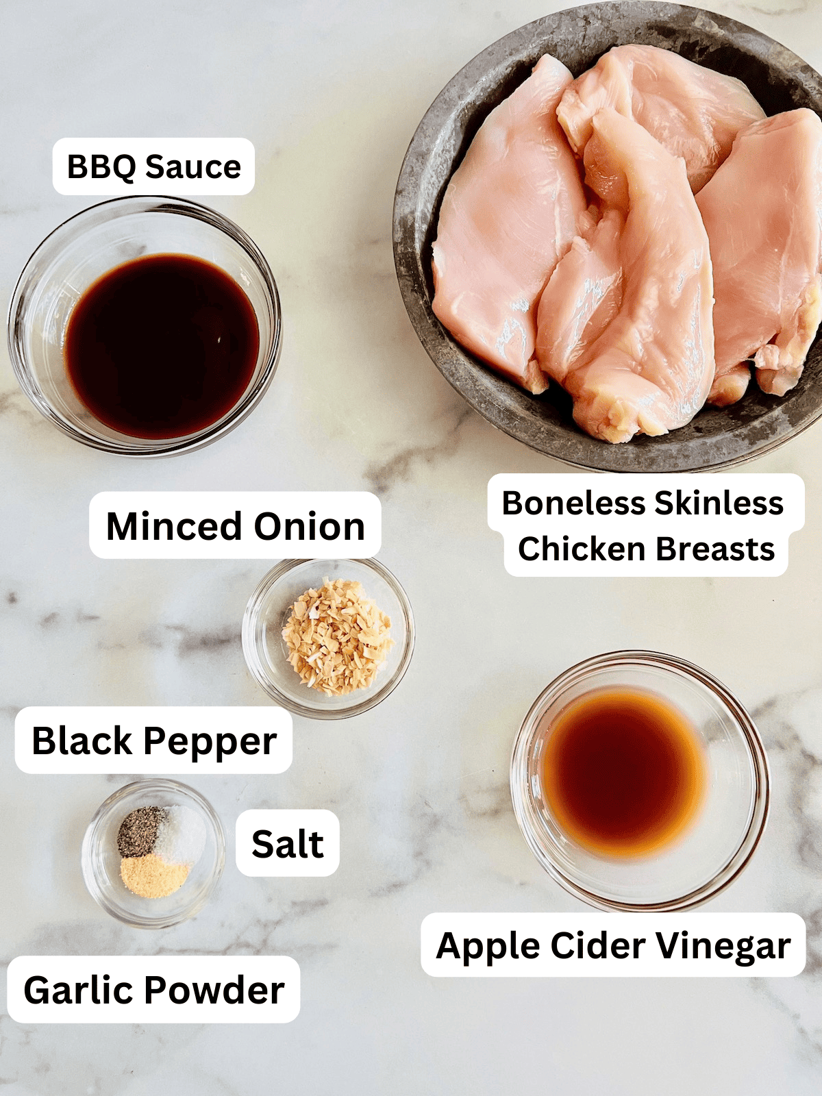 Labeled ingredients for making pulled chicken in the slow cooker.