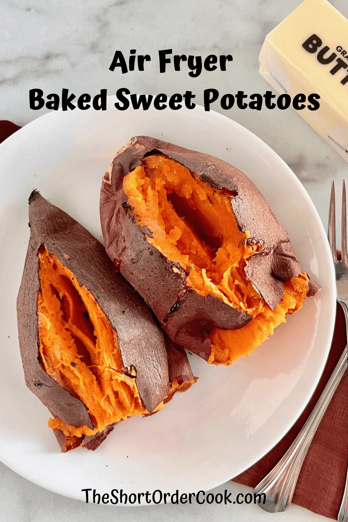 Cooked Sweet Potatoes cut open on a plate.