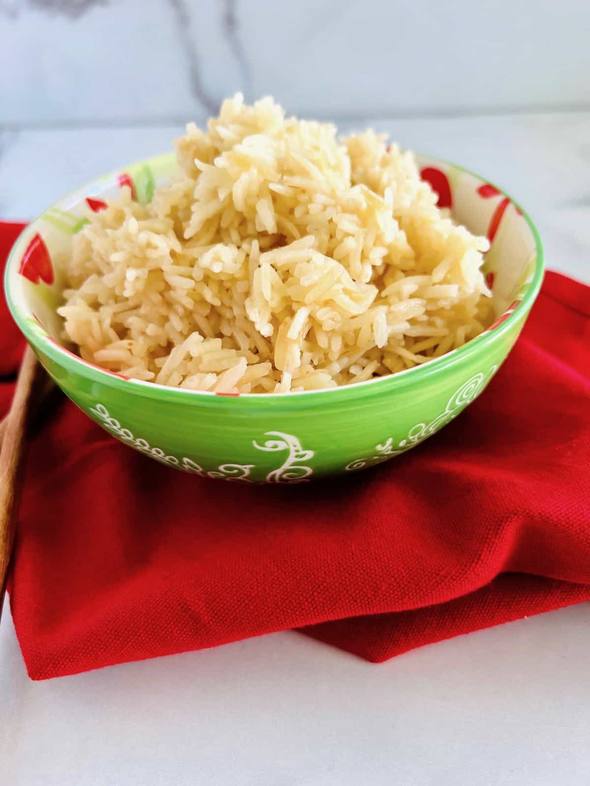 Chicken Broth Rice Piled up in a green bowl ready to eat