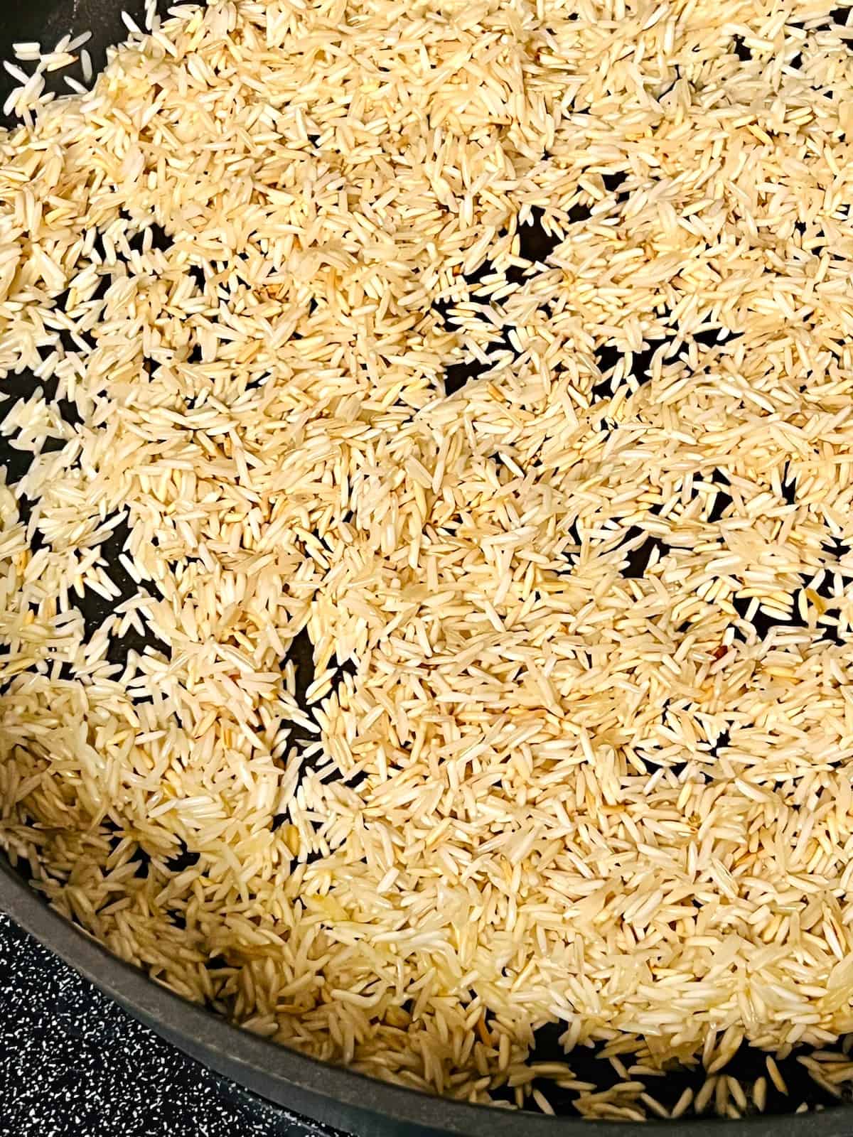 Toasted rice in the skillet.
