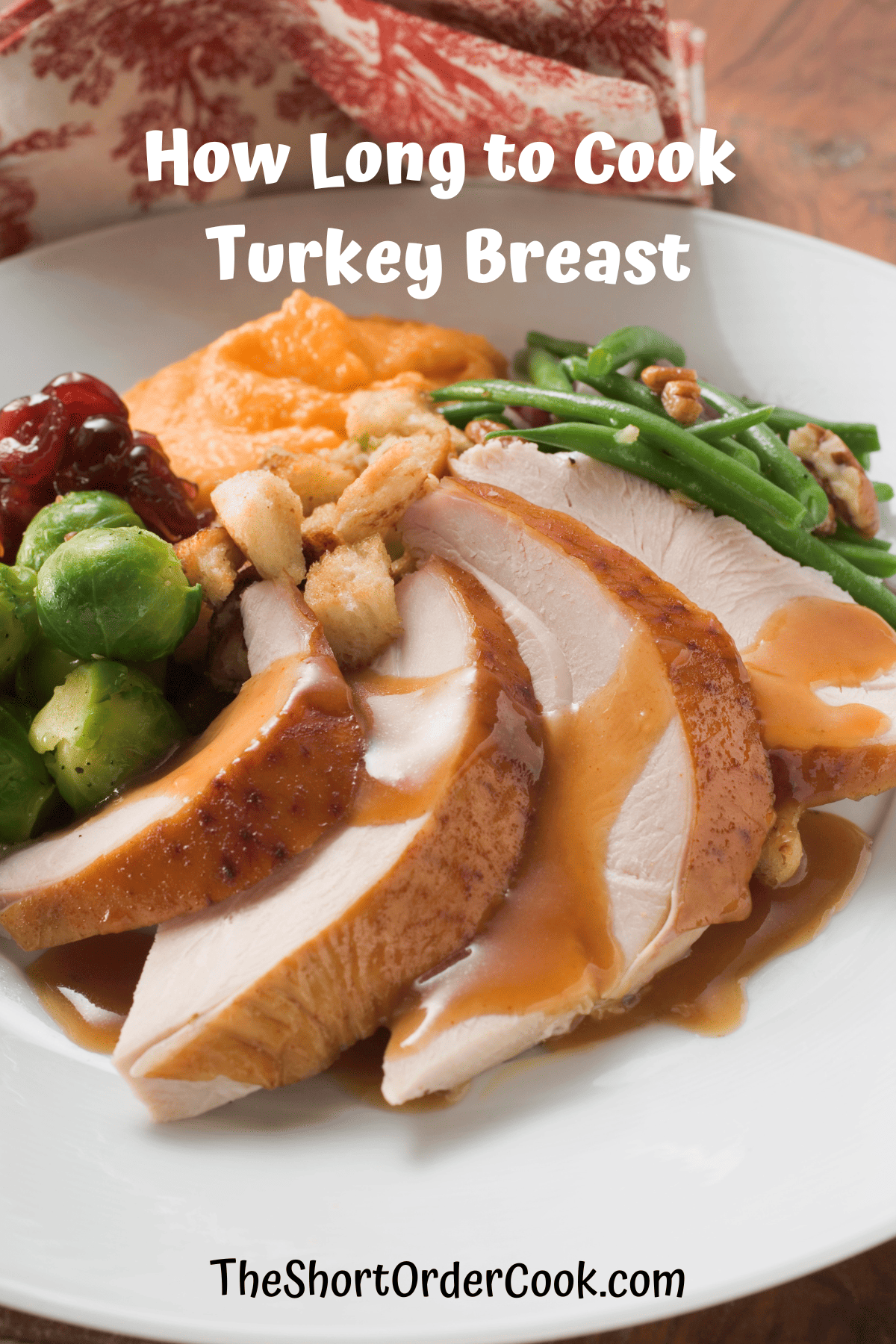 Sliced roasted boneless turkey breast plated with Thanksgiving sides of brussels sprouts and mashed sweet potatoes.